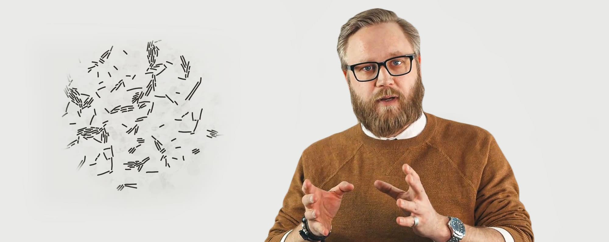 Oskar Henriksson föreläser om öl framför en tavla med kemisk formel.